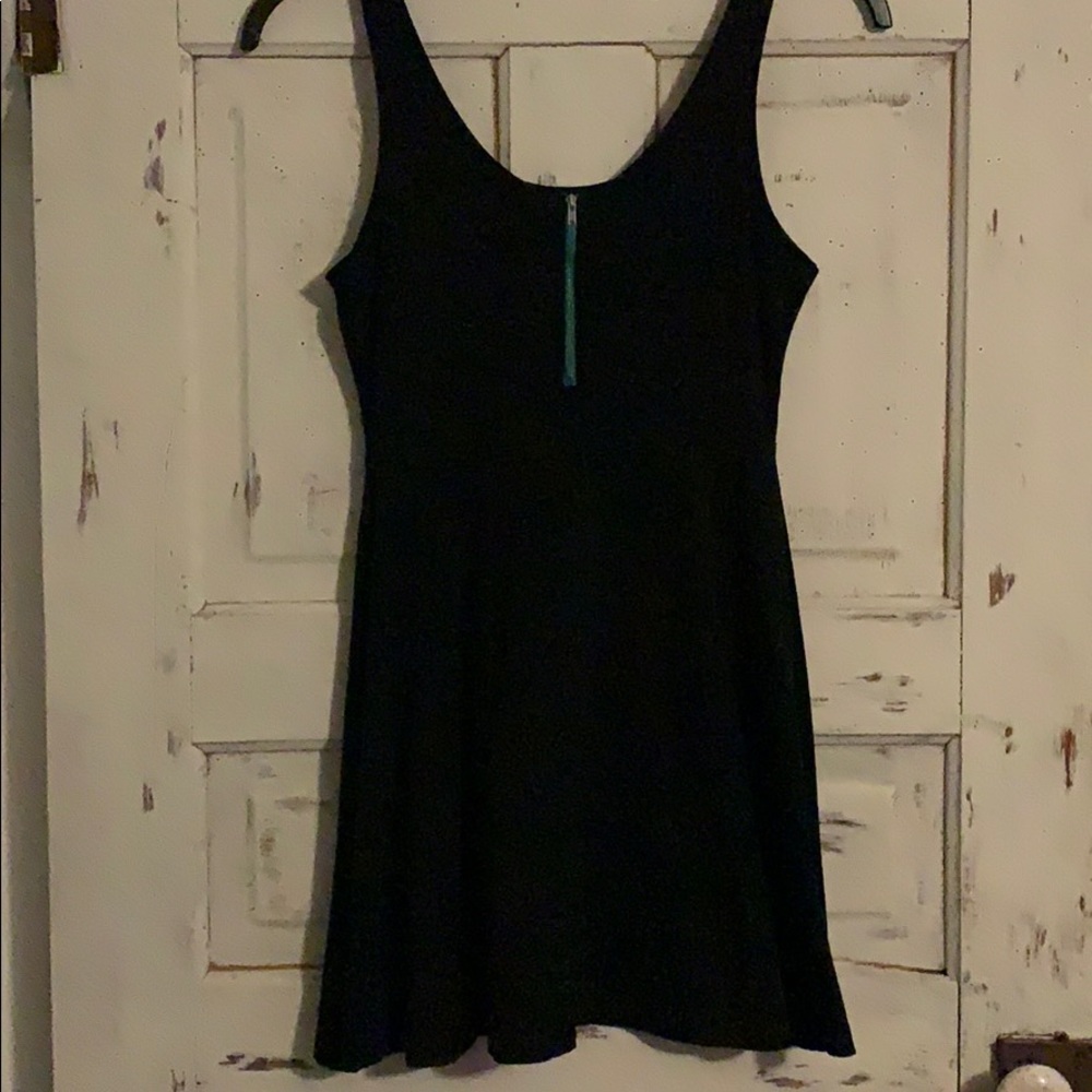 Adorable simple black dress with green zipper